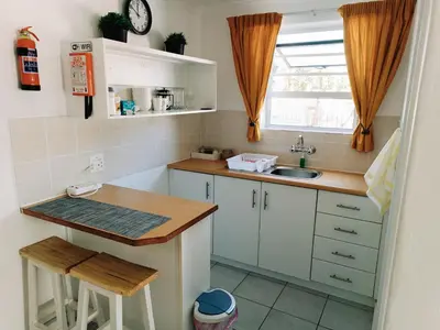 a small kitchen with a sink and a counter at NoulAnouk's Corner - Peaceful Studio in Cape Town
