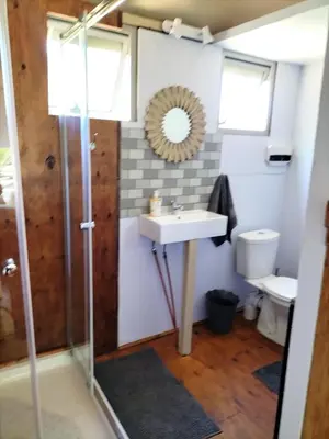 a bathroom with a sink and a toilet at Glamping at The Well in Franschhoek in Franschhoek
