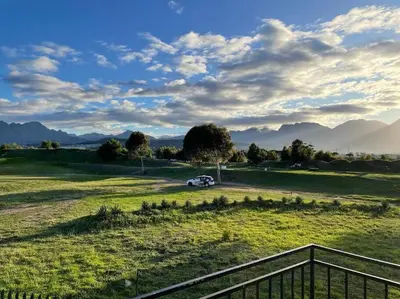 a car parked in the middle of a field at Mini Suits in Cape Town