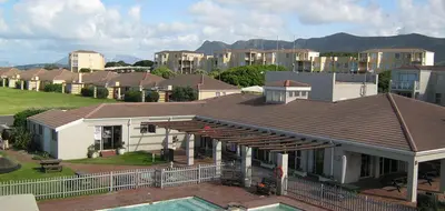 a house with a pool in front of it at Hermanus Sea Breeze in Hermanus