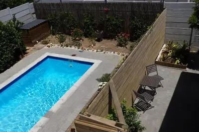 an overhead view of a swimming pool in a backyard at Maîté Iphupho in Somerset West