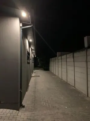 a dark alley with a hallway with lights on it at Maîté Iphupho in Somerset West