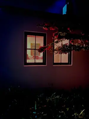 a house with two windows in a dark room at Tollbosch in Somerset West