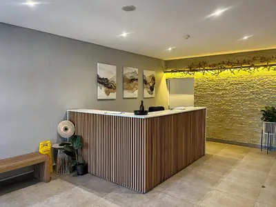 a lobby with a reception desk in a building at Portico 1006 Beachfront Apartment with Panoramic Views in Cape Town