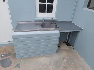 a sink in a room with a window at Island Time in Hermanus