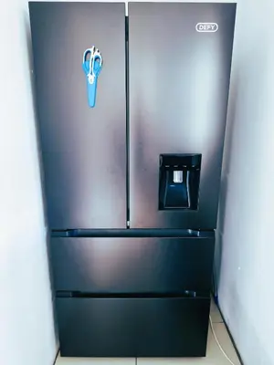 a refrigerator in a room with a sign on it at Regent Casa’s in Cape Town