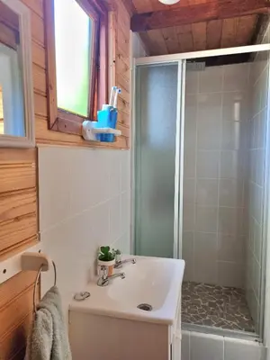 a bathroom with a white sink and a shower at 81 Kingfisher in Lake Marina