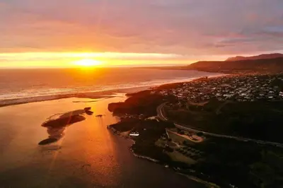 an aerial view of a beach at sunset at Great spot with a view in Hermanus , South Africa in Hermanus